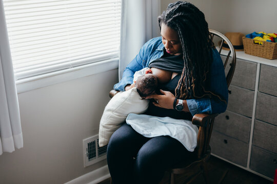 African American mother breastfeeding baby