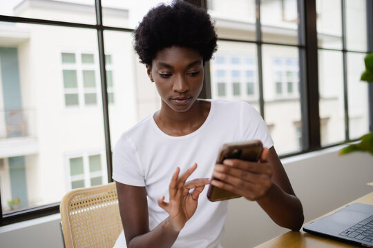 Business Woman Using Smart Phone In Office