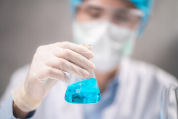 Fototapeta premium Health care researchers working in life science laboratory, medical science technology research work for test a vaccine, coronavirus covid-19 vaccine protection cure treatment