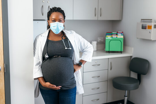 Portrait of Black female pregnant doctor, healthcare professional