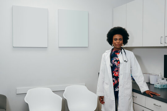 Portrait of Black female pediatrician in her office