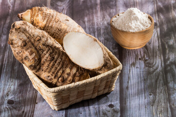 Taro Root of Colocasia esculenta and Organic Taro Flour in a bowl