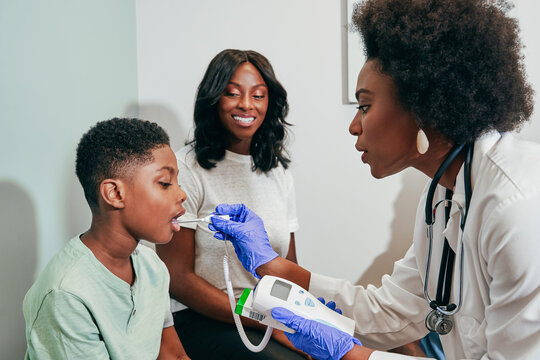 Pediatrician examining patient