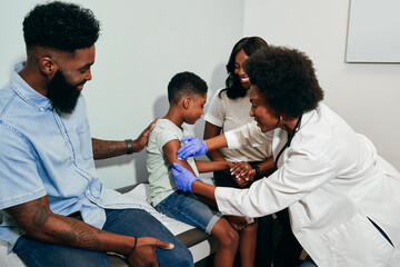 Pediatrician prepares child for vaccine shot