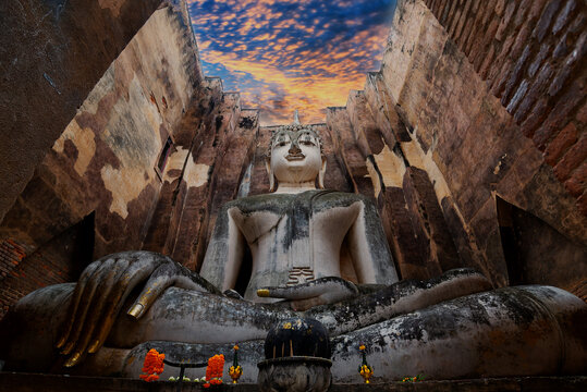 Seated Buddha image at Wat Si Chum temple in Sukhothai Historical Park, a UNESCO world heritage site, Thailand. Travel Concept.
