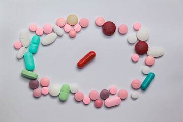 Colored pills or drugs on a neutral background. Medicines for legal use.