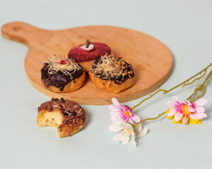 Donuts with various toppings. A delicious snack that is suitable to eat in your spare time. Potato-based donuts are healthy for your body if consumed in the right amount. Sweet and savory donuts.
