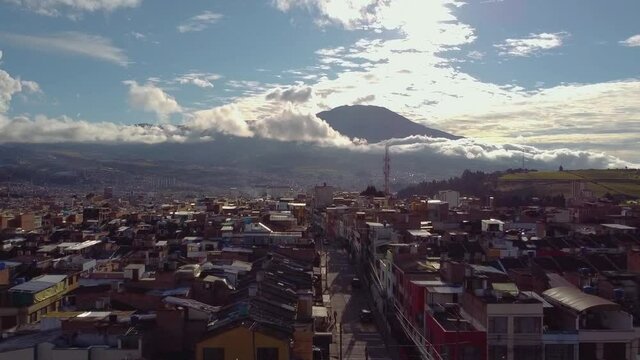 Aerial view of the city of PASTO located at the base of the Galeras volcano. spectacular view of an active volcano. nari&ntilde;o surprise city of colombia bird's eye view majestic sunset. san juan de pasto.