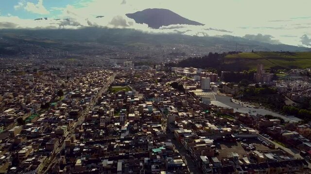 Aerial view of the city of PASTO located at the base of the Galeras volcano. spectacular view of an active volcano. nari&ntilde;o surprise city of colombia bird's eye view majestic sunset. san juan de pasto.