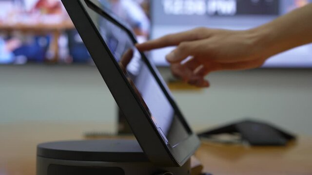Finger touch the screen during conference in the meeting room with screen in the background. Technology, online meeting workplace concept b-roll footage. People having meeting and touch the screen.