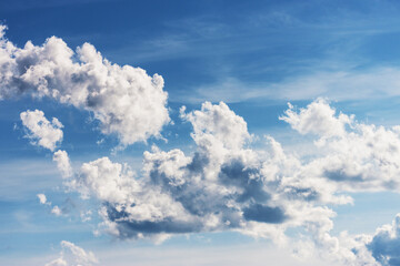 Naklejka na ściany i meble Clouds on a clear sunny summer day.