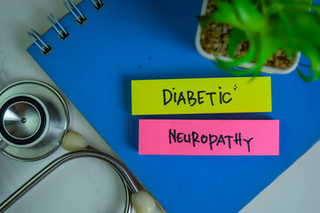 Diabetic Neuropathy write on sticky notes isolated on Wooden Table.