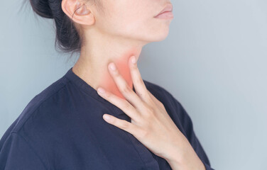 Women suffering from acid reflux. a burning sensation in the throat There is sputum inside. Chest...