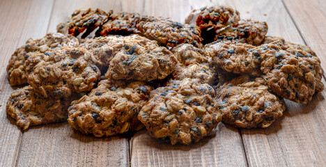 Homemade fragrant fresh baked goods. Oatmeal cookies lie on a wooden table.