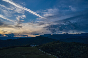 Evening panoramic view of mount with beautiful sky. Sunset in mountains