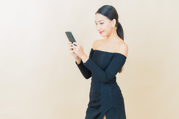Fototapeta premium Portrait beautiful young asian woman smile with smart mobile phone