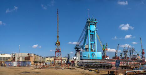 Fototapeta na wymiar Large shipyard crane in Chernomorsk, Ukraine