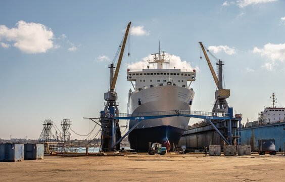 Large ship in dry dock of shipyard
