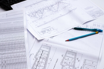 Naklejka na ściany i meble drawings of a construction engineer on a sheet of paper
