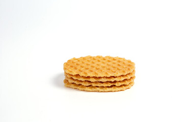 Stack of crispy waffles isolated on a white background.