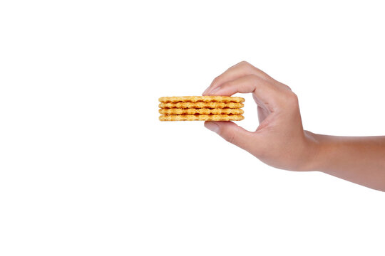 Hand hold crispy waffles isolated on white background