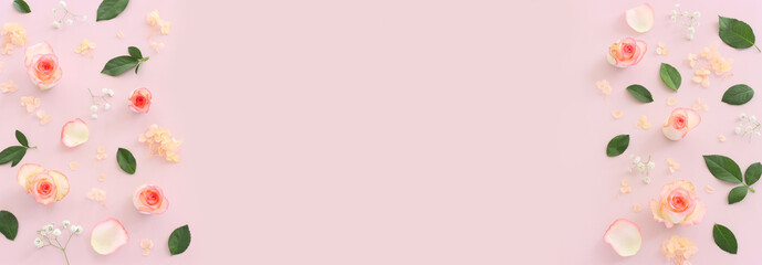 Pastel delicate background with pink roses and petals. Top view