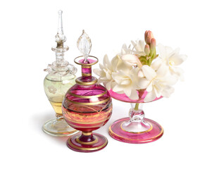 Agave amica, formerly Polianthes tuberosa or tuberose. With perfume bottles. Isolated on white background