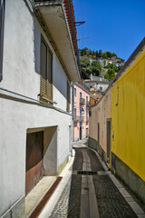 A small street between the old houses of Castelluccio Superiore, a small town in the province of Potenza in Basilicata, Italy.