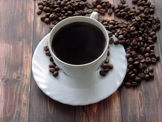 a cup of coffee and grains on the table