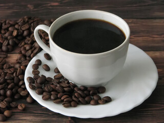 a cup of coffee and grains on the table