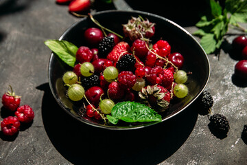 Summer berries in a plate on the table.