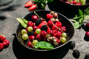 Summer berries in a plate on the table.