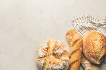 Assortment of fresh bread on light background