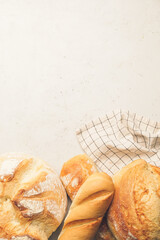 Assortment of fresh bread on light background