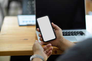 Closeup, businessman holding smartphone blank screen mockup
