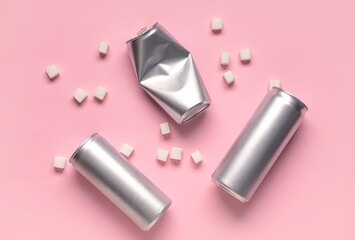 Cans of soda and sugar on color background. Diabetes concept