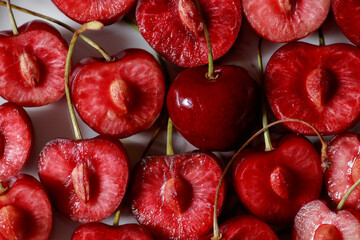 Delicious juicy sliced cherry and one whole berry.