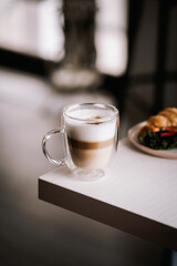 coffee and croissant on the table