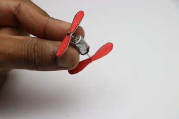Small dual shaft dc motor with propellers attached to its shaft. Mini motor to make fans, turbines...