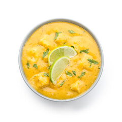 Bowl of tasty chicken curry on white background