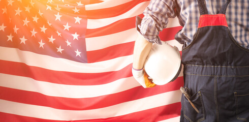 Worker on nation flag background. Labor day holiday concept. USA