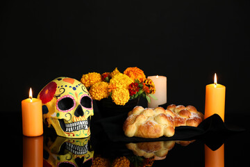 Bread of the dead and painted skull on dark background. Celebration of Mexico's Day of the Dead (El...