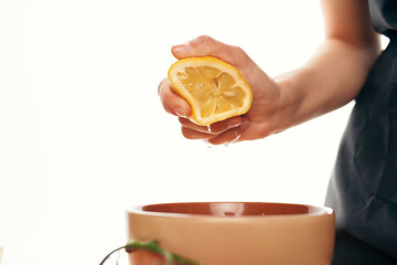 squeezing lemon into salad plate ingredient cooking