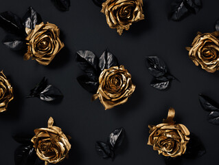 Dark romantic pattern with beautiful golden roses with black leaves isolated on a black background....
