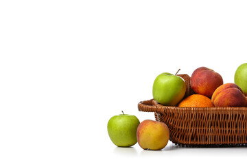 Basket with fresh fruits on white background