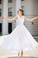 young ballerina dancing in the street