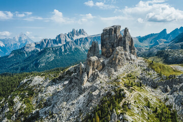 Aerial view of Cinque Torri in Dolomites mountains in Italy. Epic landscape on a sunny day of summer