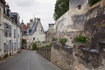 Fototapeta na wymiar Child, boy walking in a beautiful small village street in France