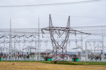 Distribution electric substation with power lines and transformers. High voltage power transformer...