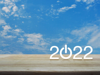 2022 start up business flat icon on wooden table over blue sky with white clouds, Happy new year 2022 cover concept